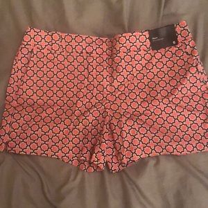 Pink patterned shorts (size 6)